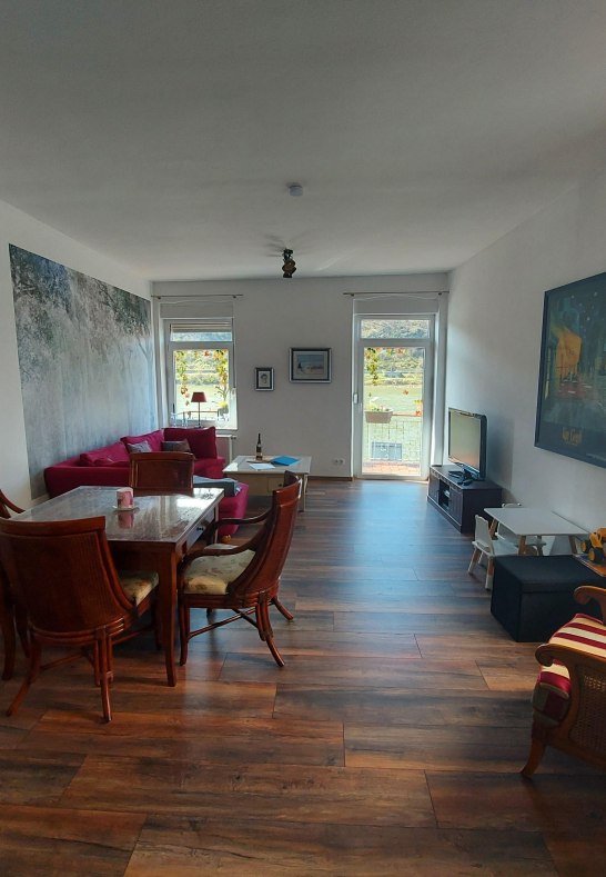 Sterrenberg living and dining room with wood stove | © Heimes